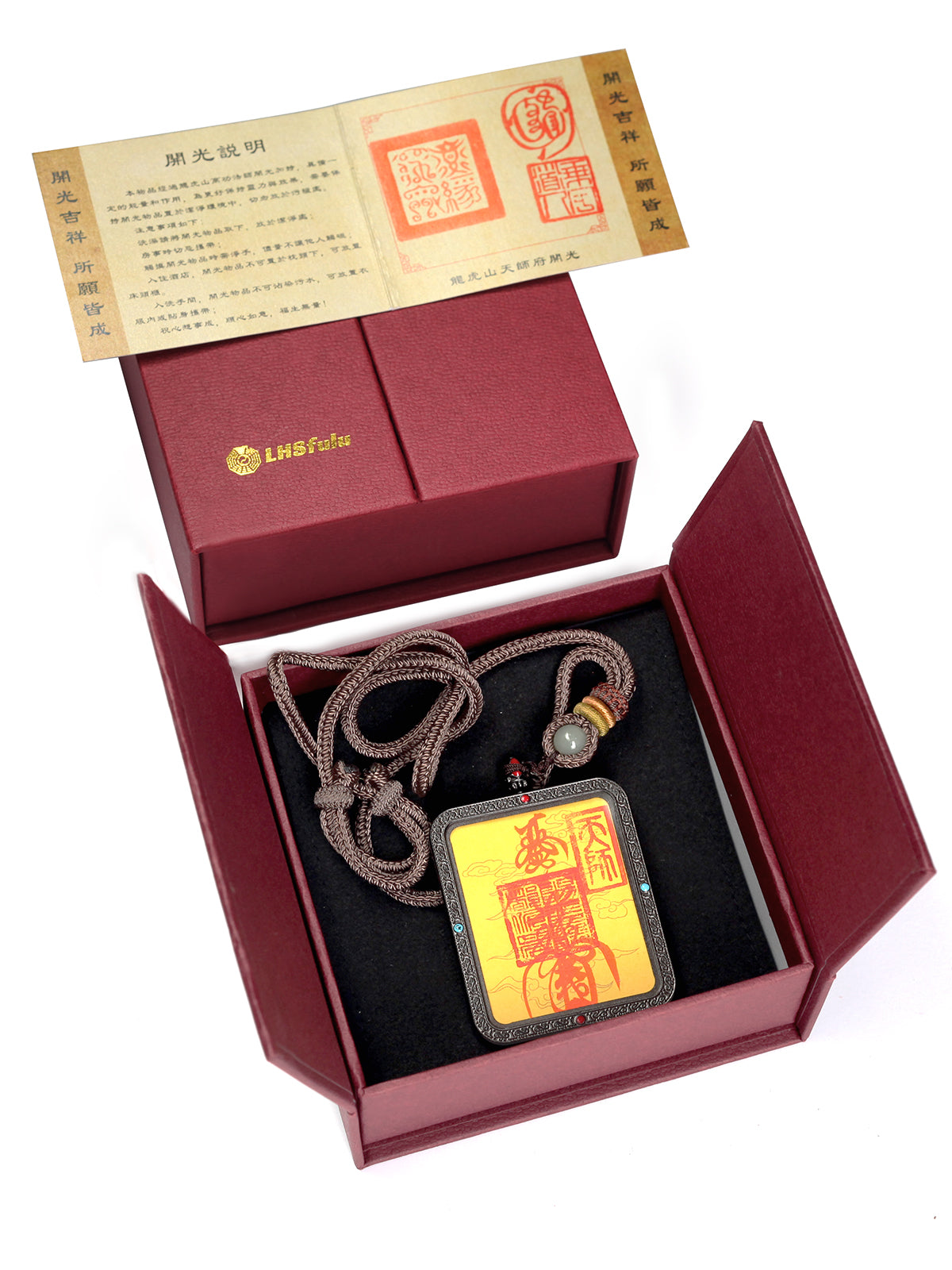 this talisman is personally hand-drawn by an orthodox Taoist master. An initiated High Priest then inscribes the talisman, channeling the sacred energy of the ancestral court, before sealing it within an exquisitely crafted Ghau box. This Peace & Safety Talisman serves to protect your body and safeguard your well-being, warding off malevolent influences and neutralizing negative energy. It helps you steer clear of disasters, mitigates the impact of unforeseen accidents, and provides the wearer with comp