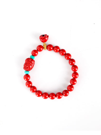 this piece draws upon the auspicious signs of the ""Pixiu gathering wealth, and the Lotus Pod gathering connections."" Crafted from refined Chenzhou Cinnabar into the forms of a guardian Pixiu and a seed-bearing Lotus Pod, it embodies the principle of ""All Requests Granted, and Ten Thousand Connections Harmonized."" It is a supreme ritual implement that merges a thousand-year spiritual tradition with profound protective energy.