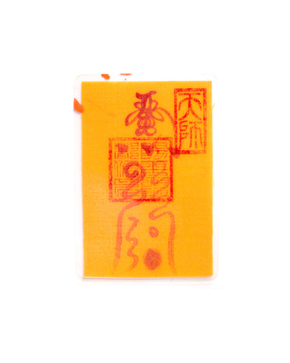 Close-up of a mobile phone charm or sticker featuring a traditional Chinese Taoist talisman, hand-drawn by an orthodox Zhengyi lineage master from Longhu Mountain. It is spiritually crafted to dispel bad luck, transform negative energy, strengthen the magnetic field for good fortune, clear life barriers, and attract auspicious energy for career and relationship success.