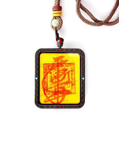 this talisman is personally hand-drawn by an orthodox Taoist master. An initiated High Priest then inscribes the talisman, channeling the sacred energy of the ancestral court, before sealing it within an exquisitely crafted Ghau box. This Peace &amp; Safety Talisman serves to protect your body and safeguard your well-being, warding off malevolent influences and neutralizing negative energy. It helps you steer clear of disasters, mitigates the impact of unforeseen accidents, and provides the wearer with comp