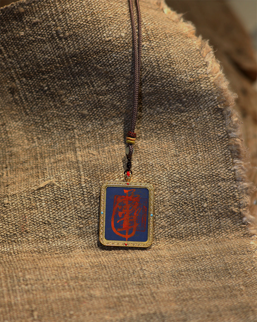 this talisman is personally hand-drawn by an orthodox Taoist master. An initiated High Priest then inscribes the talisman, channeling the sacred energy of the ancestral court, before sealing it within an exquisitely crafted Ghau box. This Peace &amp; Safety Talisman serves to protect your body and safeguard your well-being, warding off malevolent influences and neutralizing negative energy. It helps you steer clear of disasters, mitigates the impact of unforeseen accidents, and provides the wearer with comp