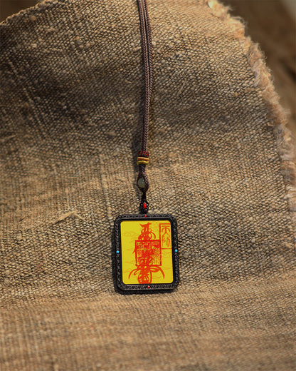 this talisman is personally hand-drawn by an orthodox Taoist master. An initiated High Priest then inscribes the talisman, channeling the sacred energy of the ancestral court, before sealing it within an exquisitely crafted Ghau box. This Peace &amp; Safety Talisman serves to protect your body and safeguard your well-being, warding off malevolent influences and neutralizing negative energy. It helps you steer clear of disasters, mitigates the impact of unforeseen accidents, and provides the wearer with comp
