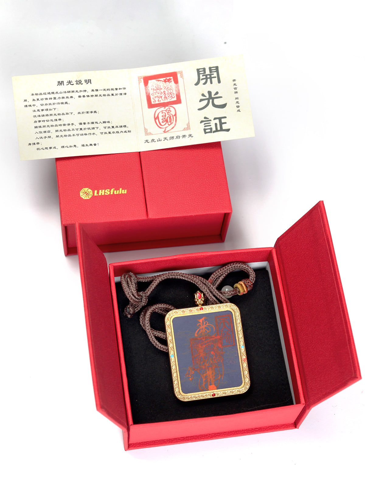 this talisman is personally hand-drawn by an orthodox Taoist master. An initiated High Priest then inscribes the talisman, channeling the sacred energy of the ancestral court, before sealing it within an exquisitely crafted Ghau box. This Peace &amp; Safety Talisman serves to protect your body and safeguard your well-being, warding off malevolent influences and neutralizing negative energy. It helps you steer clear of disasters, mitigates the impact of unforeseen accidents, and provides the wearer with comp