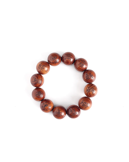 This bracelet is crafted from specially selected natural thunderstruck wood of exceptionally strong energy. Upon the surface of the beads are not ordinary talismanic script, but rather the 'Mihui' (Secret Celestial Names), personally hand-drawn by a High Priest of Longhu Mountain. 'Mihui' are the core cosmic passwords and secret designations of the deities in the celestial realm. They are the most direct path to communicating with the power of a specific divinity. Each Secret Name corresponds to a single de